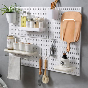 Wall-Mounted Pegboard Organizer with Hooks and Bins